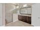 Contemporary main bathroom featuring a walk-in shower, double vanity and modern finishes at 4127 Broad Porch Run, Land O Lakes, FL 34638