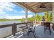Picturesque view from the covered patio with a lake view with plenty of table seating at 4127 Broad Porch Run, Land O Lakes, FL 34638