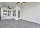 Enclosed patio with ceiling fans and tile flooring at 4127 Broad Porch Run, Land O Lakes, FL 34638
