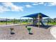 Community playground with swings, slide, and covered play area at 4127 Broad Porch Run, Land O Lakes, FL 34638