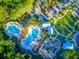 Aerial view showcasing swimming pools, playground and recreational areas at 4127 Broad Porch Run, Land O Lakes, FL 34638