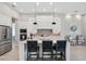 Bright kitchen showcasing a large island, white cabinets, and stainless steel appliances at 4135 Epic Cv, Land O Lakes, FL 34638