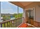 Balcony view of the community pool area surrounded by vibrant, mature trees and blue skies at 4207 S Dale Mabry Hwy # 2412, Tampa, FL 33611