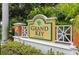 Grand Key community sign featuring lush landscaping, stucco walls, and decorative entrance features at 4207 S Dale Mabry Hwy # 2412, Tampa, FL 33611