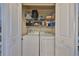 Laundry closet with new, full-sized washer and dryer and plenty of storage space and shelving at 4207 S Dale Mabry Hwy # 2412, Tampa, FL 33611