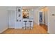 Open living area features breakfast bar seating, natural light, and laminate flooring throughout at 4207 S Dale Mabry Hwy # 2412, Tampa, FL 33611