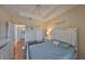 Inviting main bedroom features tray ceilings, wood floors, calming colors, and easy bath access at 4207 S Dale Mabry Hwy # 2412, Tampa, FL 33611