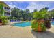 Community pool surrounded by landscaping at 4207 S Dale Mabry Hwy # 2412, Tampa, FL 33611