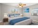 Comfortable bedroom with a ceiling fan, natural light and a serene atmosphere at 4218 2Nd S Ave, St Petersburg, FL 33711