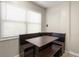 Dining room with a built-in booth and natural light from the large window at 4218 2Nd S Ave, St Petersburg, FL 33711