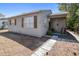 Cozy single-story home features wood shutters, a covered porch, and a well-maintained walkway at 4218 2Nd S Ave, St Petersburg, FL 33711