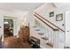 Bright hallway with stairs and beautiful wood accents at 4520 W Rosemere Rd, Tampa, FL 33609