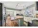 Functional kitchen with white cabinets, wood countertop island, and natural light at 4520 W Rosemere Rd, Tampa, FL 33609