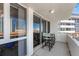 Balcony seating area offers a view of the city with skyscrapers in the background and clear sky at 470 3Rd S St # 814, St Petersburg, FL 33701