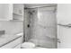 Bright bathroom featuring a glass-enclosed shower and granite counters at 470 3Rd S St # 814, St Petersburg, FL 33701