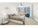 Bright bedroom features a ceiling fan, a large window with a city view, and modern decor at 470 3Rd S St # 814, St Petersburg, FL 33701