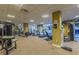 Well-equipped gym featuring treadmills, weight machines, and floor mats with expansive windows overlooking the pool at 470 3Rd S St # 814, St Petersburg, FL 33701