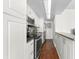 Galley kitchen features white cabinetry, stainless steel appliances, and granite countertops at 470 3Rd S St # 814, St Petersburg, FL 33701