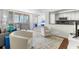Bright living room featuring a balcony with city views and an open floor plan with a combined dining area at 470 3Rd S St # 814, St Petersburg, FL 33701
