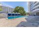 Inviting pool area with lounge chairs and shade for relaxation at 470 3Rd S St # 814, St Petersburg, FL 33701