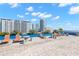 Rooftop deck area with lounge chairs, tables, and stunning city views at 470 3Rd S St # 814, St Petersburg, FL 33701