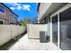 Enclosed patio with white fence and sliding glass door at 5034 Blue Latan Ln, Tampa, FL 33610