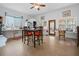 Spacious kitchen with dining table, white cabinetry, and a bright, airy atmosphere with views to the outside at 505 Orange St, Palm Harbor, FL 34683