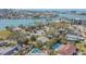 Stunning aerial view of waterfront homes, lush greenery, and azure waters, showcasing the community's beauty and prime location at 55 Dolphin Dr # A, Treasure Island, FL 33706