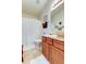 Cozy bathroom featuring a toilet and vanity with wood cabinets at 565 52Nd N Ave, St Petersburg, FL 33703