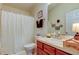 Cozy bathroom featuring a toilet and vanity with wood cabinets at 565 52Nd N Ave, St Petersburg, FL 33703