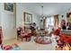 Bright dining space features a glass table, four chairs, and whimsical decor, creating a cozy and inviting atmosphere at 565 52Nd N Ave, St Petersburg, FL 33703