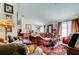 Spacious living area showcases eclectic decor, a comfortable sofa, and abundant natural light, creating a cozy atmosphere at 565 52Nd N Ave, St Petersburg, FL 33703