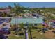 Aerial view of the community clubhouse and pool area with surrounding palm trees at 6125 113Th St # 505, Seminole, FL 33772