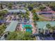 Aerial view of the community pool, clubhouse, parking areas, and surrounding landscape at 6125 113Th St # 505, Seminole, FL 33772
