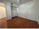 A cozy bedroom features wood floors and a closet with shelving for organized storage at 6125 113Th St # 505, Seminole, FL 33772