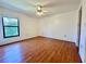 Bright bedroom with wood floors and a ceiling fan, offering a comfortable living space at 6125 113Th St # 505, Seminole, FL 33772