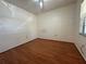Bright bedroom with wood floors and a window at 6125 113Th St # 505, Seminole, FL 33772