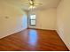 Spacious bedroom featuring wood floors and a window offering natural light at 6125 113Th St # 505, Seminole, FL 33772