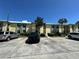 Exterior view of the condominium complex with assigned parking and well-kept landscaping at 6125 113Th St # 505, Seminole, FL 33772