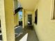 Inviting front entrance with textured walls and covered walkway leading to unit 505 at 6125 113Th St # 505, Seminole, FL 33772