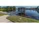 Picturesque pond and gazebo with grass in the foreground and a paved walkway to the left at 6125 113Th St # 505, Seminole, FL 33772