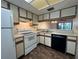 Bright kitchen featuring white appliances and ample counter space at 6125 113Th St # 505, Seminole, FL 33772