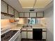 Clean kitchen with stainless steel sink and modern appliances at 6125 113Th St # 505, Seminole, FL 33772
