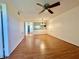 Bright living room featuring hardwood floors and a ceiling fan at 6125 113Th St # 505, Seminole, FL 33772