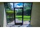 Screened patio showcasing the outdoor space and landscaping at 6125 113Th St # 505, Seminole, FL 33772