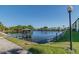 Picturesque pond with a gazebo, seen from the grass, with a walkway at 6125 113Th St # 505, Seminole, FL 33772