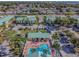A high angle view of the pool surrounded by palm trees and sunbathing residents at 6125 113Th St # 505, Seminole, FL 33772