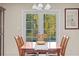 Dining room with natural light and a view to the back yard at 614 Vanderbaker Rd, Temple Terrace, FL 33617