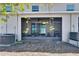 View of the screened-in patio with an AC unit and view of the lawn at 708 Barclay Wood Dr, Ruskin, FL 33570