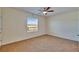 Unfurnished bedroom with neutral carpeting, a window, and a ceiling fan at 708 Barclay Wood Dr, Ruskin, FL 33570